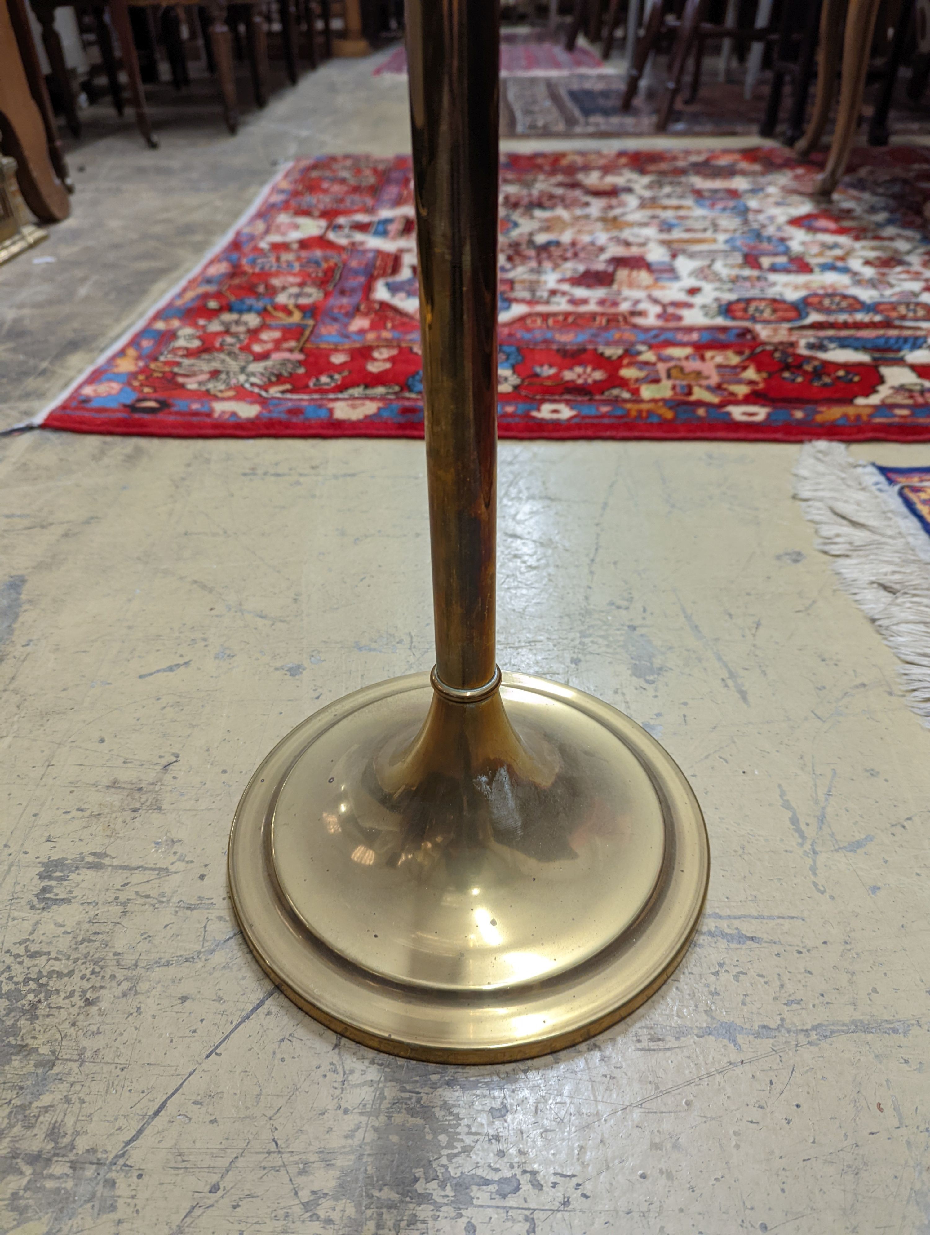 An Edwardian brass telescopic floor lamp converted to electricity